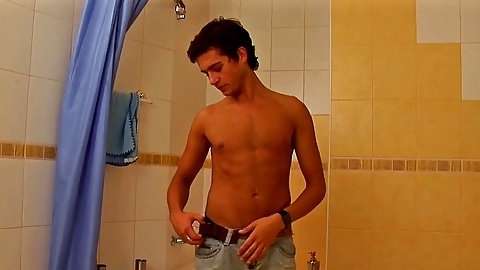 Kinky twink Joshua D gets his stiff dick out in the shower for some solo fun