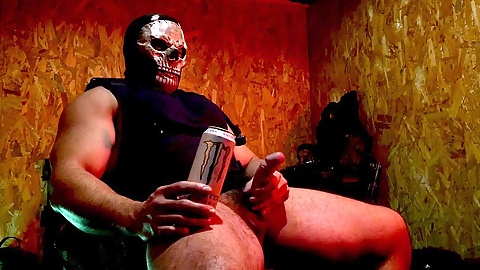 Buff guy in uniform giving himself a handjob with his massive cock