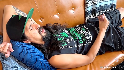 Maxx Stoner lets loose with a big jizz shot during a solo session on the sofa