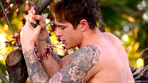 Jock gives a wild handjob to a muscle hunk outdoors in a full scene