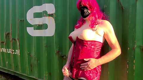 Big soft fake tits crossdresser having jacking off by a shipping container