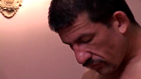 Tattooed dude gets his hairy ass and mouth pumped by a massive man